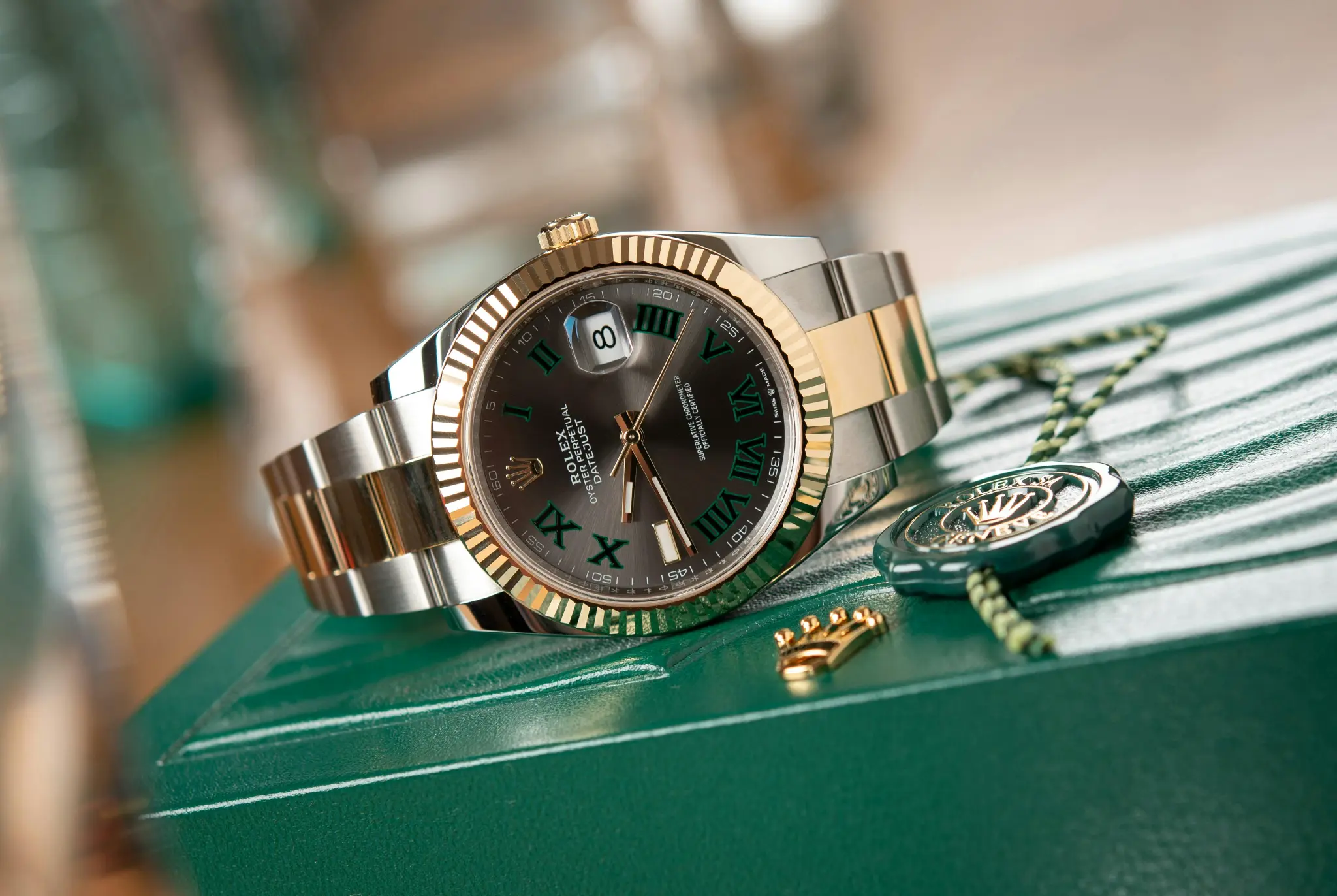 Rolex Datejust on its green presentation box